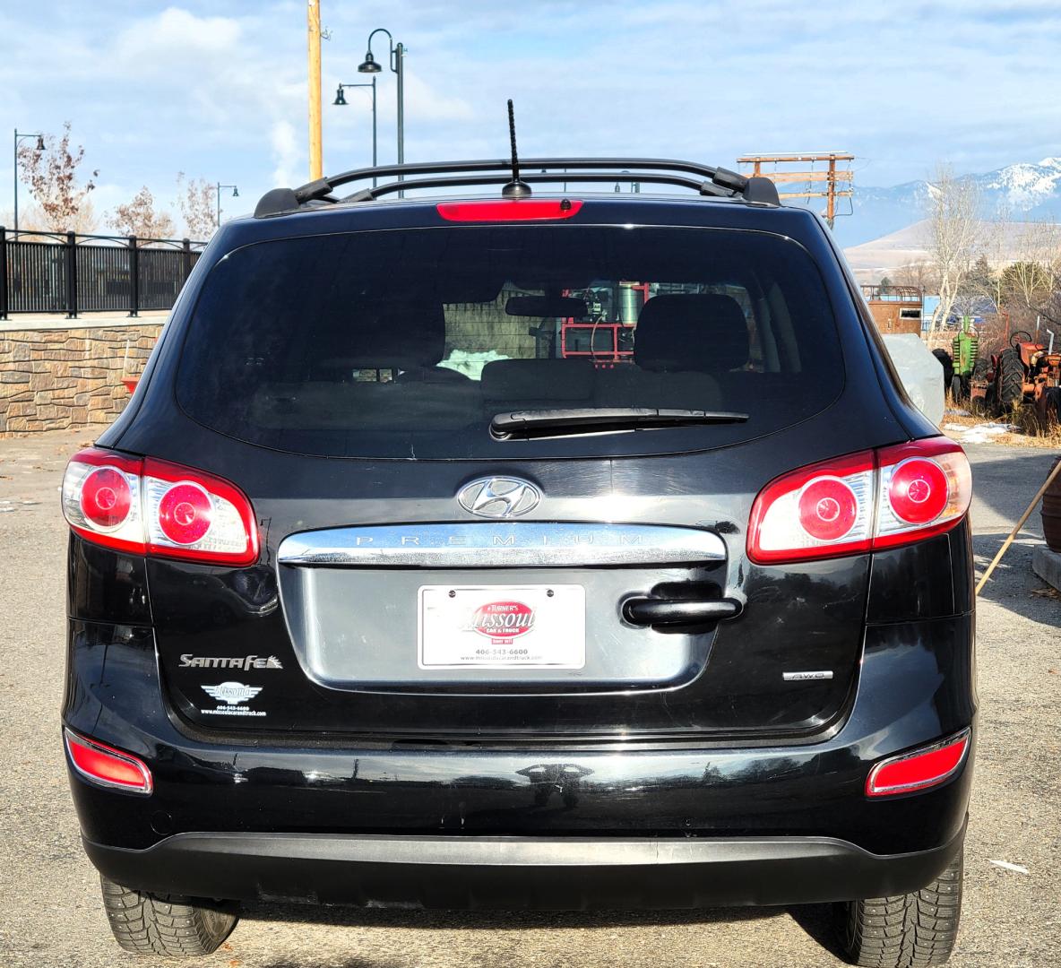 2012 Black /Tan Hyundai Santa Fe Premium (5XYZGDAB1CG) with an 2.4L I4 engine, 8 Speed Automatic transmission, located at 450 N Russell, Missoula, MT, 59801, (406) 543-6600, 46.874496, -114.017433 - NICE AWD SUV. Automatic Transmission. Air. Cruise. Tilt. Power Windows and Locks. AM FM XM Cd Player. Bluetooth. Two Sets of Tires. Studded Snow Tires are currently on. - Photo#6